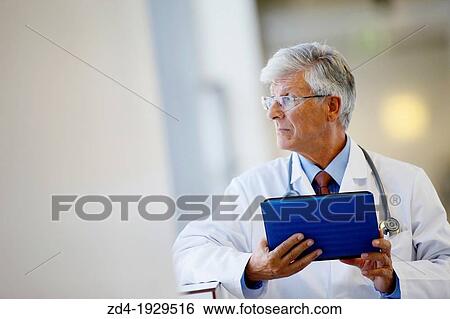 Doctor with tablet in corridor, Onkologikoa Hospital, Oncology Institute, Case Center for prevention, diagnosis and treatment of cancer, Donostia, San Sebastian, Gipuzkoa, Basque Country, Spain View Large Photo Image Stock Photograph - Doctor with tablet in corridor, Onkologikoa Hospital, Oncology Institute, Case Center for prevention, diagnosis and treatment of cancer, Donostia, San Sebastian, Gipuzkoa, Basque Country, Spain. Fotosearch