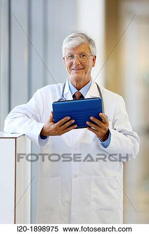 Doctor with tablet in corridor, Onkologikoa Hospital, Oncology Institute, Case Center for prevention, diagnosis and treatment of cancer, Donostia, San Sebastian, Gipuzkoa, Basque Country, Spain View Large Photo Image Stock Photography - Doctor with tablet in corridor, Onkologikoa Hospital, Oncology Institute, Case Center for prevention, diagnosis and treatment of cancer, Donostia, San Sebastian, Gipuzkoa, Basque Country, Spain. Fotosearch