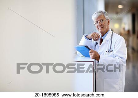 Doctor with tablet in corridor, Onkologikoa Hospital, Oncology Institute, Case Center for prevention, diagnosis and treatment of cancer, Donostia, San Sebastian, Gipuzkoa, Basque Country, Spain View Large Photo Image Stock Photography - Doctor with tablet in corridor, Onkologikoa Hospital, Oncology Institute, Case Center for prevention, diagnosis and treatment of cancer, Donostia, San Sebastian, Gipuzkoa, Basque Country, Spain. Fotosearch