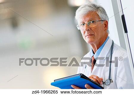 Doctor with tablet in corridor, Onkologikoa Hospital, Oncology Institute, Case Center for prevention, diagnosis and treatment of cancer, Donostia, San Sebastian, Gipuzkoa, Basque Country, Spain View Large Photo Image Stock Photography - Doctor with tablet in corridor, Onkologikoa Hospital, Oncology Institute, Case Center for prevention, diagnosis and treatment of cancer, Donostia, San Sebastian, Gipuzkoa, Basque Country, Spain. Fotosearch