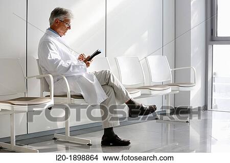 Doctor with tablet in waiting room, Onkologikoa Hospital, Oncology Institute, Case Center for prevention, diagnosis and treatment of cancer, Donostia, San Sebastian, Gipuzkoa, Basque Country, Spain View Large Photo Image Picture - Doctor with tablet in waiting room, Onkologikoa Hospital, Oncology Institute, Case Center for prevention, diagnosis and treatment of cancer, Donostia, San Sebastian, Gipuzkoa, Basque Country, Spain. Fotosearch