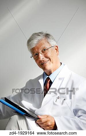 Doctor with tablet in waiting room, Onkologikoa Hospital, Oncology Institute, Case Center for prevention, diagnosis and treatment of cancer, Donostia, San Sebastian, Gipuzkoa, Basque Country, Spain View Large Photo Image Picture - Doctor with tablet in waiting room, Onkologikoa Hospital, Oncology Institute, Case Center for prevention, diagnosis and treatment of cancer, Donostia, San Sebastian, Gipuzkoa, Basque Country, Spain. Fotosearch