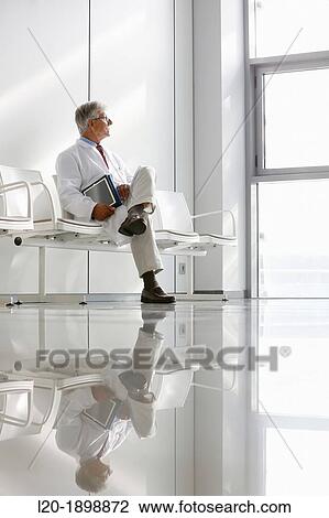 Doctor with tablet in waiting room, Onkologikoa Hospital, Oncology Institute, Case Center for prevention, diagnosis and treatment of cancer, Donostia, San Sebastian, Gipuzkoa, Basque Country, Spain View Large Photo Image Stock Image - Doctor with tablet in waiting room, Onkologikoa Hospital, Oncology Institute, Case Center for prevention, diagnosis and treatment of cancer, Donostia, San Sebastian, Gipuzkoa, Basque Country, Spain. Fotosearch
