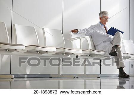 Doctor with tablet in waiting room, Onkologikoa Hospital, Oncology Institute, Case Center for prevention, diagnosis and treatment of cancer, Donostia, San Sebastian, Gipuzkoa, Basque Country, Spain View Large Photo Image Stock Image - Doctor with tablet in waiting room, Onkologikoa Hospital, Oncology Institute, Case Center for prevention, diagnosis and treatment of cancer, Donostia, San Sebastian, Gipuzkoa, Basque Country, Spain. Fotosearch