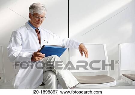 Doctor with tablet in waiting room, Onkologikoa Hospital, Oncology Institute, Case Center for prevention, diagnosis and treatment of cancer, Donostia, San Sebastian, Gipuzkoa, Basque Country, Spain View Large Photo Image Stock Photo - Doctor with tablet in waiting room, Onkologikoa Hospital, Oncology Institute, Case Center for prevention, diagnosis and treatment of cancer, Donostia, San Sebastian, Gipuzkoa, Basque Country, Spain. Fotosearch