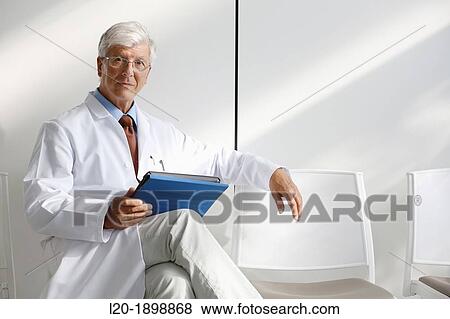 Doctor with tablet in waiting room, Onkologikoa Hospital, Oncology Institute, Case Center for prevention, diagnosis and treatment of cancer, Donostia, San Sebastian, Gipuzkoa, Basque Country, Spain View Large Photo Image Stock Photo - Doctor with tablet in waiting room, Onkologikoa Hospital, Oncology Institute, Case Center for prevention, diagnosis and treatment of cancer, Donostia, San Sebastian, Gipuzkoa, Basque Country, Spain. Fotosearch