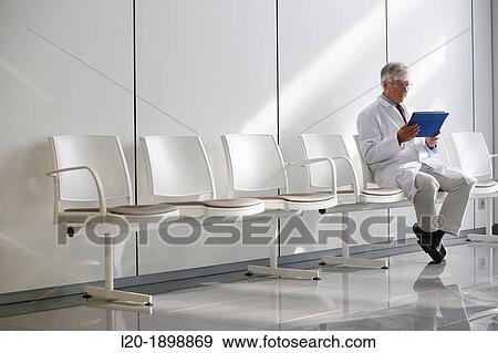 Doctor with tablet in waiting room, Onkologikoa Hospital, Oncology Institute, Case Center for prevention, diagnosis and treatment of cancer, Donostia, San Sebastian, Gipuzkoa, Basque Country, Spain View Large Photo Image Stock Photo - Doctor with tablet in waiting room, Onkologikoa Hospital, Oncology Institute, Case Center for prevention, diagnosis and treatment of cancer, Donostia, San Sebastian, Gipuzkoa, Basque Country, Spain. Fotosearch