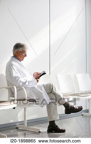 Doctor with tablet in waiting room, Onkologikoa Hospital, Oncology Institute, Case Center for prevention, diagnosis and treatment of cancer, Donostia, San Sebastian, Gipuzkoa, Basque Country, Spain View Large Photo Image Stock Photography - Doctor with tablet in waiting room, Onkologikoa Hospital, Oncology Institute, Case Center for prevention, diagnosis and treatment of cancer, Donostia, San Sebastian, Gipuzkoa, Basque Country, Spain. Fotosearch