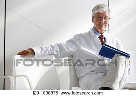 Doctor with tablet in waiting room, Onkologikoa Hospital, Oncology Institute, Case Center for prevention, diagnosis and treatment of cancer, Donostia, San Sebastian, Gipuzkoa, Basque Country, Spain View Large Photo Image Stock Photography - Doctor with tablet in waiting room, Onkologikoa Hospital, Oncology Institute, Case Center for prevention, diagnosis and treatment of cancer, Donostia, San Sebastian, Gipuzkoa, Basque Country, Spain. Fotosearch