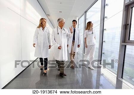 Doctors and nurses walking in corridor, Onkologikoa Hospital, Oncology Institute, Case Center for prevention, diagnosis and treatment of cancer, Donostia, San Sebastian, Gipuzkoa, Basque Country, Spain View Large Photo Image Picture - Doctors and nurses walking in corridor, Onkologikoa Hospital, Oncology Institute, Case Center for prevention, diagnosis and treatment of cancer, Donostia, San Sebastian, Gipuzkoa, Basque Country, Spain. Fotosearch
