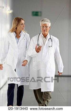 Doctors and nurses walking in corridor, Onkologikoa Hospital, Oncology Institute, Case Center for prevention, diagnosis and treatment of cancer, Donostia, San Sebastian, Gipuzkoa, Basque Country, Spain View Large Photo Image Stock Image - Doctors and nurses walking in corridor, Onkologikoa Hospital, Oncology Institute, Case Center for prevention, diagnosis and treatment of cancer, Donostia, San Sebastian, Gipuzkoa, Basque Country, Spain. Fotosearch