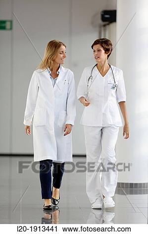 Doctors and nurses walking in corridor, Onkologikoa Hospital, Oncology Institute, Case Center for prevention, diagnosis and treatment of cancer, Donostia, San Sebastian, Gipuzkoa, Basque Country, Spain View Large Photo Image Stock Image - Doctors and nurses walking in corridor, Onkologikoa Hospital, Oncology Institute, Case Center for prevention, diagnosis and treatment of cancer, Donostia, San Sebastian, Gipuzkoa, Basque Country, Spain. Fotosearch