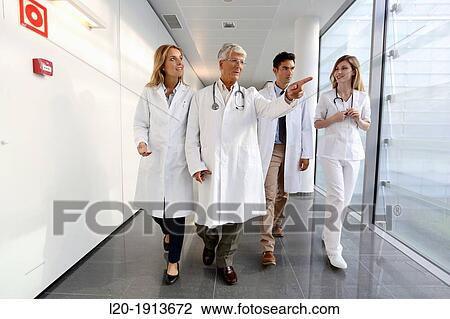 Doctors and nurses walking in corridor, Onkologikoa Hospital, Oncology Institute, Case Center for prevention, diagnosis and treatment of cancer, Donostia, San Sebastian, Gipuzkoa, Basque Country, Spain View Large Photo Image Stock Image - Doctors and nurses walking in corridor, Onkologikoa Hospital, Oncology Institute, Case Center for prevention, diagnosis and treatment of cancer, Donostia, San Sebastian, Gipuzkoa, Basque Country, Spain. Fotosearch