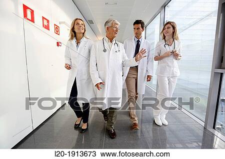 Doctors and nurses walking in corridor, Onkologikoa Hospital, Oncology Institute, Case Center for prevention, diagnosis and treatment of cancer, Donostia, San Sebastian, Gipuzkoa, Basque Country, Spain View Large Photo Image Stock Image - Doctors and nurses walking in corridor, Onkologikoa Hospital, Oncology Institute, Case Center for prevention, diagnosis and treatment of cancer, Donostia, San Sebastian, Gipuzkoa, Basque Country, Spain. Fotosearch