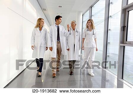 Doctors and nurses walking in corridor, Onkologikoa Hospital, Oncology Institute, Case Center for prevention, diagnosis and treatment of cancer, Donostia, San Sebastian, Gipuzkoa, Basque Country, Spain View Large Photo Image Stock Image - Doctors and nurses walking in corridor, Onkologikoa Hospital, Oncology Institute, Case Center for prevention, diagnosis and treatment of cancer, Donostia, San Sebastian, Gipuzkoa, Basque Country, Spain. Fotosearch