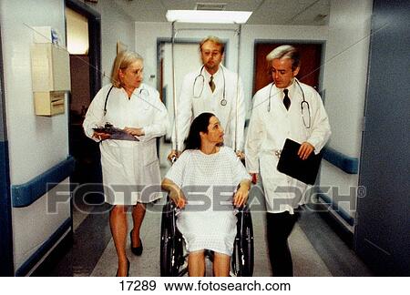 Stock Photo - Doctors and patient. Fotosearch