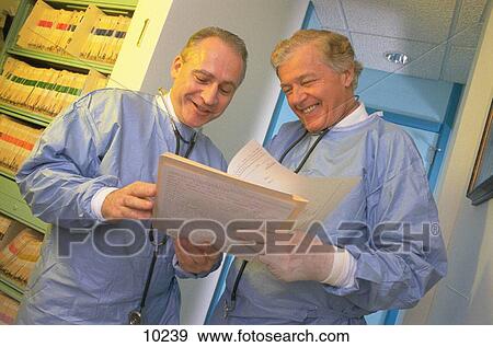 Doctors talking View Large Photo Image Stock Photo - Doctors talking. Fotosearch