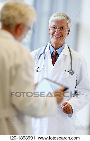Doctors with stethoscope and tablet in corridor, Onkologikoa Hospital, Oncology Institute, Case Center for prevention, diagnosis and treatment of cancer, Donostia, San Sebastian, Gipuzkoa, Basque Country, Spain View Large Photo Image Stock Image - Doctors with stethoscope and tablet in corridor, Onkologikoa Hospital, Oncology Institute, Case Center for prevention, diagnosis and treatment of cancer, Donostia, San Sebastian, Gipuzkoa, Basque Country, Spain. Fotosearch