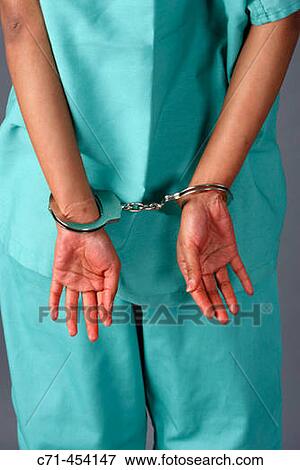 Doctor/Surgeon in handcuffs View Large Photo Image Stock Photo - Doctor/Surgeon in handcuffs. Fotosearch