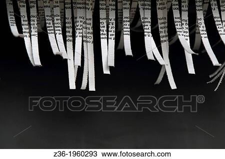 Stock Image - Document shredded by shredder.. Fotosearch