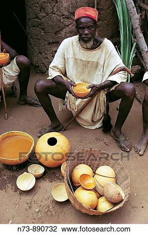Dogon man drinking millet beer, Dogon Country, Mali View Large Photo Image Stock Image - Dogon man drinking millet beer, Dogon Country, Mali. Fotosearch