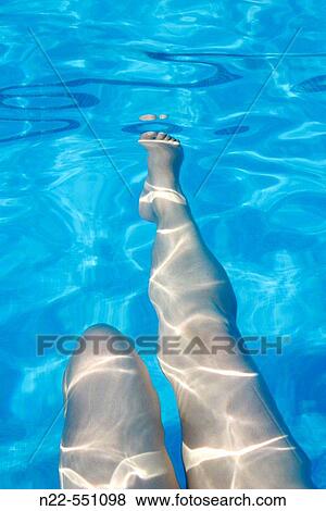 Doing exercise in swimming pool View Large Photo Image Stock Photo - Doing exercise in swimming pool. Fotosearch