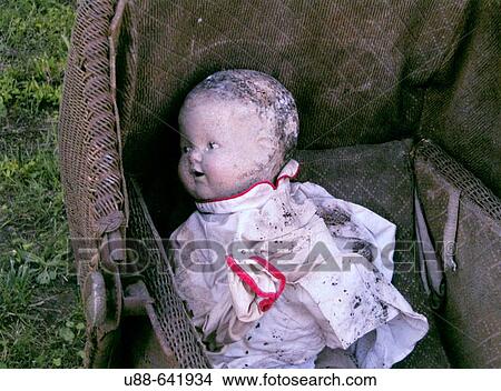 Picture - Doll in buggy. Fotosearch