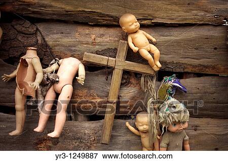 Stock Photo - Dolls hang on a building on the Island of the Dolls in Xochimilco, southern Mexico City.. Fotosearch