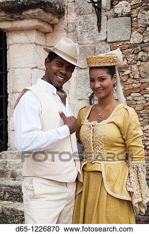 Stock Image - Dominican Republic, La Romana, Altos de Chavon, Dominican dancing couple in costume, R, MR-DRE-09-04, MR-DRE-09-05. Fotosearch