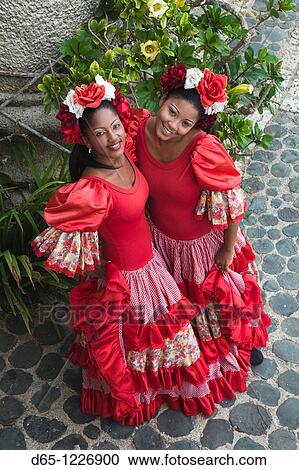Stock Image - Dominican Republic, La Romana, Altos de Chavon, Dominican female dancers in costume, R, MR-DRE-09-07 & MR-DRE-09-08. Fotosearch