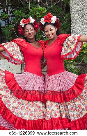 Stock Photo - Dominican Republic, La Romana, Altos de Chavon, Dominican female dancers in costume, R, MR-DRE-09-07 & MR-DRE-09-08. Fotosearch