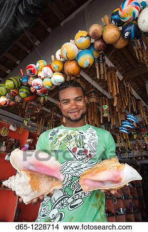Dominican Republic, Punta Cana Region, Bavaro, beach souvenir shop salesman, R, MR-DRE-09-12 View Large Photo Image Picture - Dominican Republic, Punta Cana Region, Bavaro, beach souvenir shop salesman, R, MR-DRE-09-12. Fotosearch