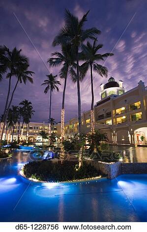 Dominican Republic, Punta Cana Region, Bavaro, Iberostar Grand Hotel, exterior, evening View Large Photo Image Stock Photograph - Dominican Republic, Punta Cana Region, Bavaro, Iberostar Grand Hotel, exterior, evening. Fotosearch