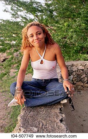 Dominican woman at sunset in Sosua, Dominican Republic View Large Photo Image Stock Photo - Dominican woman at sunset in Sosua, Dominican Republic. Fotosearch