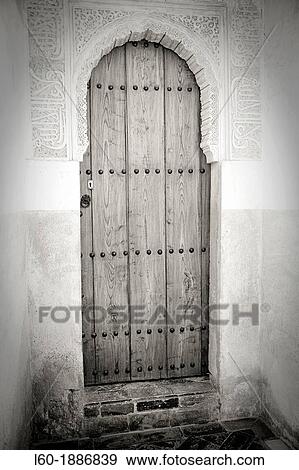 Stock Photo - Door in Courtyard of the lions Palace of the Lions Nazaries palaces Alhambra, Granada Andalusia. Fotosearch