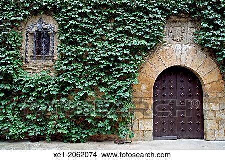 Door, ivy, Convent del Carme (14th century), Peralada, Catalonia, Spain View Large Photo Image Picture - Door, ivy, Convent del Carme (14th century), Peralada, Catalonia, Spain. Fotosearch