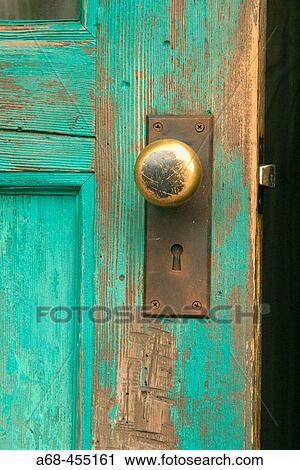 Stock Image - Door knob on wooden door.. Fotosearch