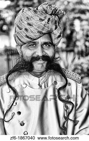 Stock Image - Doorman with great moustache and smile at Park Plaza Hotel in Jaipur Rajasthan India. Fotosearch