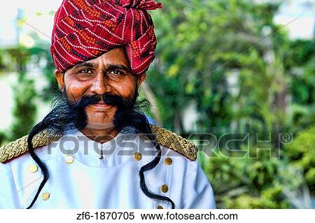 Stock Photography - Doorman with great moustache and smile at Park Plaza Hotel in Jaipur Rajasthan India. Fotosearch