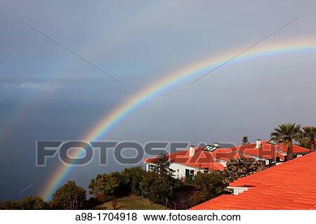 Stock Photo - double rainbow above the Atlantic Ocean at the resort Jardim Atlantico, Prazeres, Madeira, Portugal, Europe.. Fotosearch