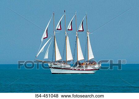 Downtown city of Chicago with the tall ship Windy sailing with tourist on Chicago Harbor. Chicago, Illinois. USA. View Large Photo Image Stock Photo - Downtown city of Chicago with the tall ship Windy sailing with tourist on Chicago Harbor. Chicago, Illinois. USA.. Fotosearch