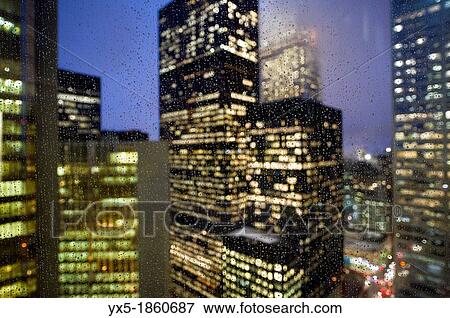 Stock Photo - Downtown lights in the rain. Fotosearch
