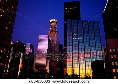 Downtown Los Angeles at early evening as the sunset is reflected off the skyline View Large Photo Image Stock Image - Downtown Los Angeles at early evening as the sunset is reflected off the skyline. Fotosearch