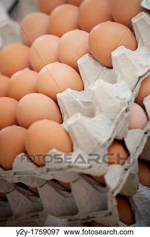 Stock Photo - Dozens of eggs in the market. Fotosearch