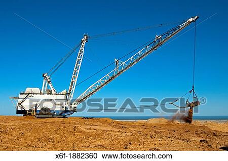 Stock Image - Dragline excavator handling overburden at the De Beers diamond mine Kleinzee, Northern Cape province, South Africa. Fotosearch