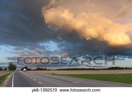 Dramatic Low Clouds Over Highway, Estonia View Large Photo Image Stock Image - Dramatic Low Clouds Over Highway, Estonia. Fotosearch