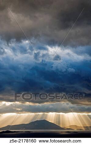 Stock Image - Dramatic sky above the Pagasitic Gulf (Thessaly, Greece).. Fotosearch