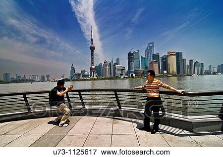 Stock Photo - Dramatic view of Pudong, Shanghai as seen from the promenade in the Bund, Puxi.. Fotosearch