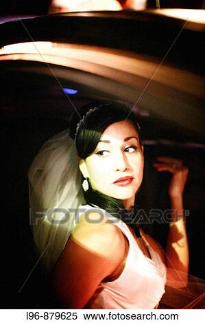 Stock Photography - dramatic, vintage, retro bride sitting in limo/ auto. Fotosearch
