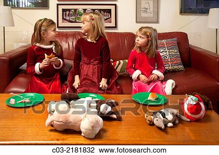Dressed in Christmas clothing, three sisters share lunch and talk at home in Laguna Niguel, CA. Note stuffed toys and different expressions. MODEL RELEASE. View Large Photo Image Stock Image - Dressed in Christmas clothing, three sisters share lunch and talk at home in Laguna Niguel, CA. Note stuffed toys and different expressions. MODEL RELEASE.. Fotosearch